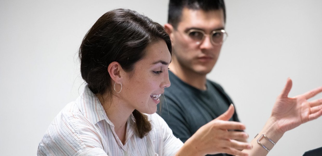 Student talking with laptop