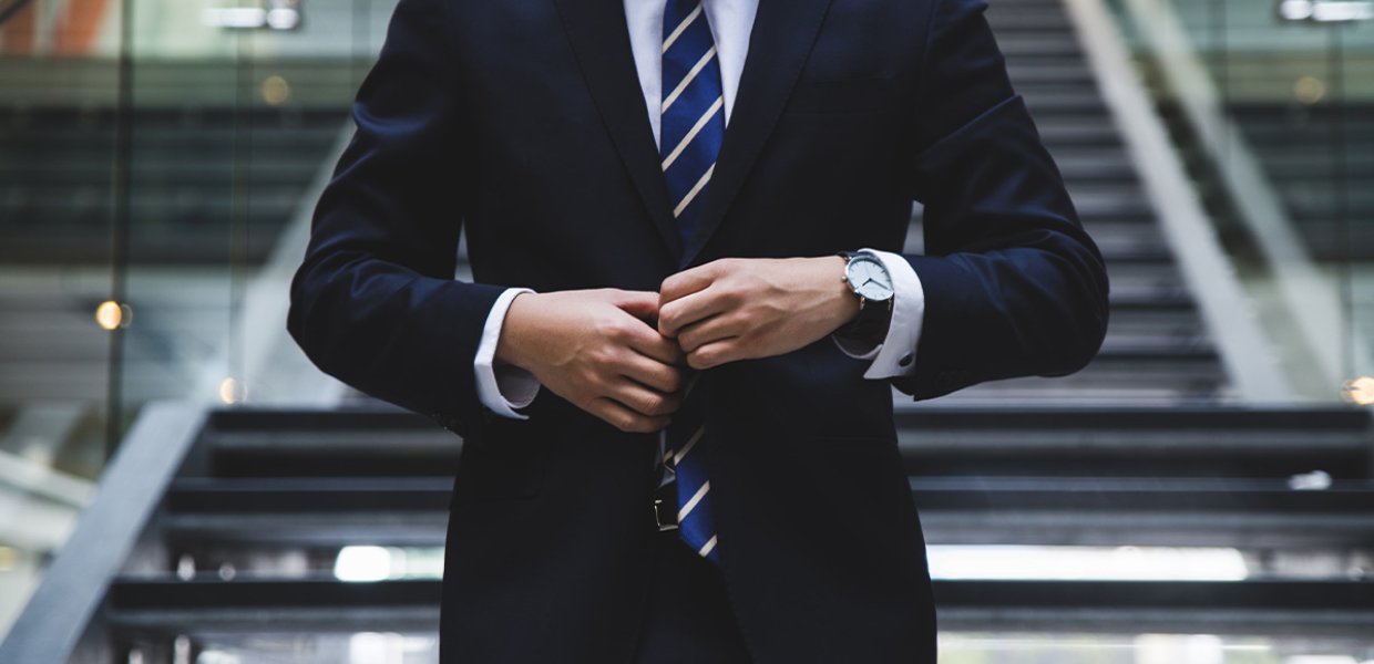 A person wearing a suit and tie