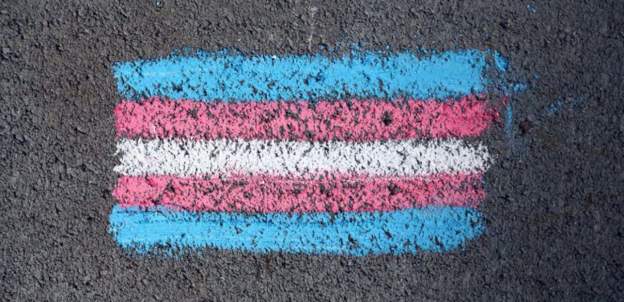 Photo of a transgender flag drawn on the street with chalk