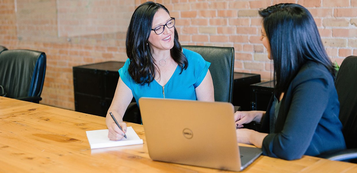 Photo of two women conversating