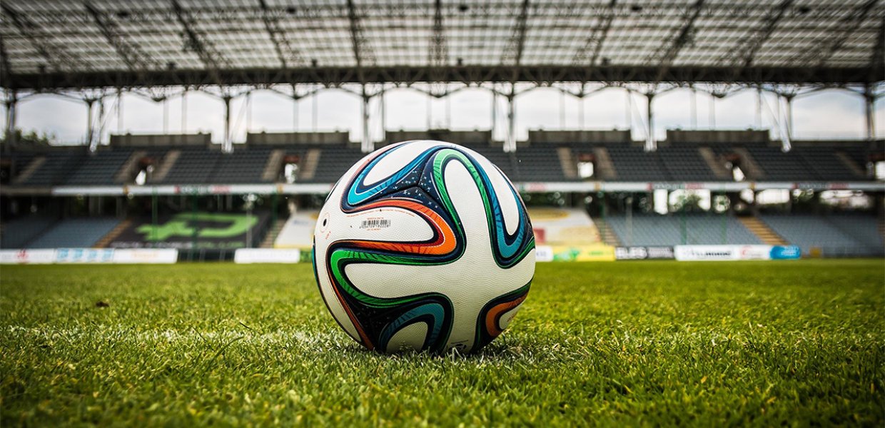 A soccer ball on a field. 