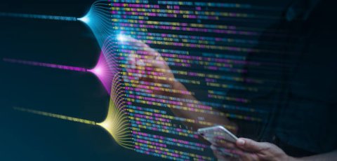 Someone interacting with code, projected into the air by light
