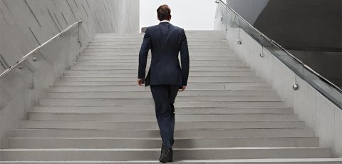 Man walking up a set of stairs