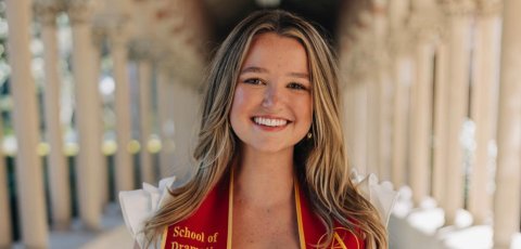 Tess Patton smiles for camera wearing USC graduation stole