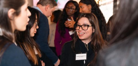Public relations and advertising major Andrea Fernandez Cruz networks in a group of people.
