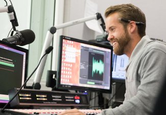 Person working in a podcasting studio