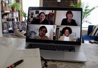 Photo of four people on a video call