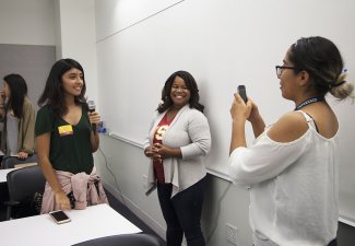 Photo of Allissa Richardson with some high school students for Annenberg high school day