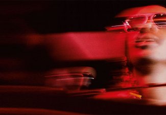 Blurred photograph of Stevie Wonder wearing shades