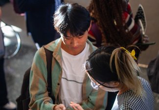 Two people talking at the 2023 career fair. 