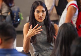 New Annenberg students socialize before the new student assembly in the ANN Forum, 2024.