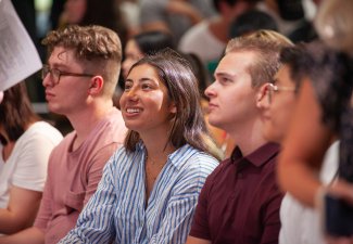 Saphia Zaman sitting at the new student assembly, 2023.