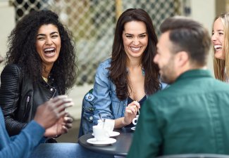 A diverse group of people laughing