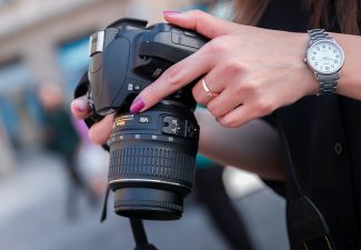 Photo of a person holding a camera