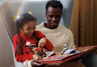 Dad and daughter reading together