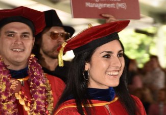 Alexandria Arrieta and Eduardo González march at the front of USC Annenberg’s processional, 2024.