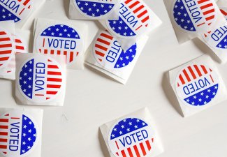 Photo of many "I voted" stickers