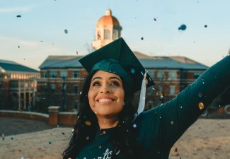 Graduating woman (happy)