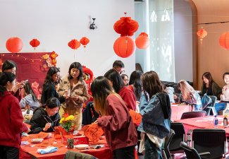 A group of students gathered around a table