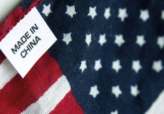 Image of a tag that reads "made in china" on an American flag