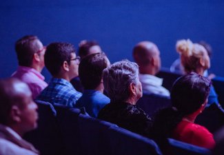 Photo of people sitting in rows