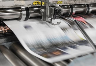 Newspaper being printed. 