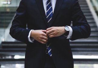 A person wearing a suit and tie