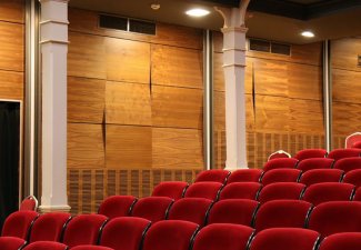 Photo of empty chairs in a movie theater