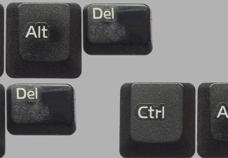 Computer keyboard keys against a grey background