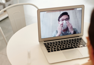 Photo of a person doing a video call on a computer