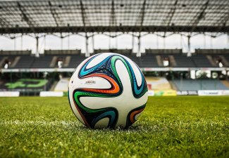 A soccer ball on a field. 