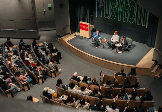 Overhead view of a conversation between Hye Jin Lee and K-pop star Yugyeom.