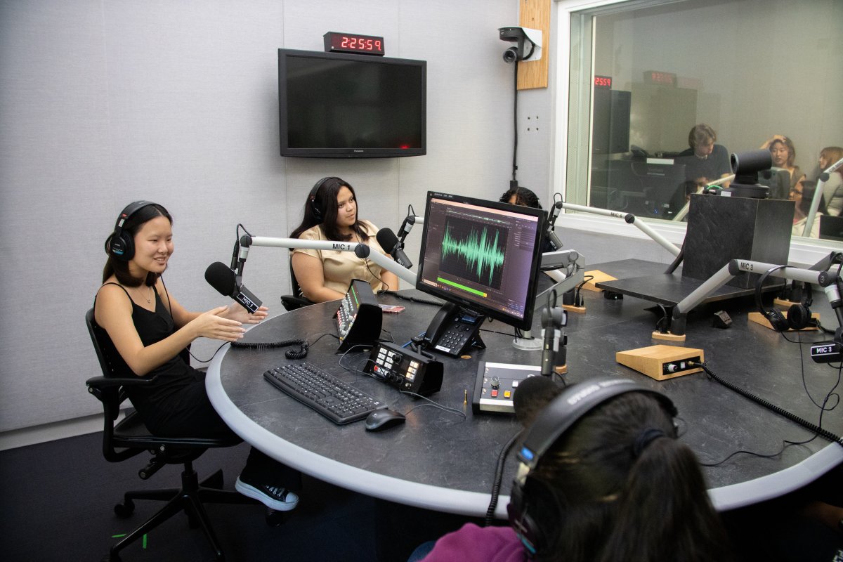 high school and college students sit in podcast studio