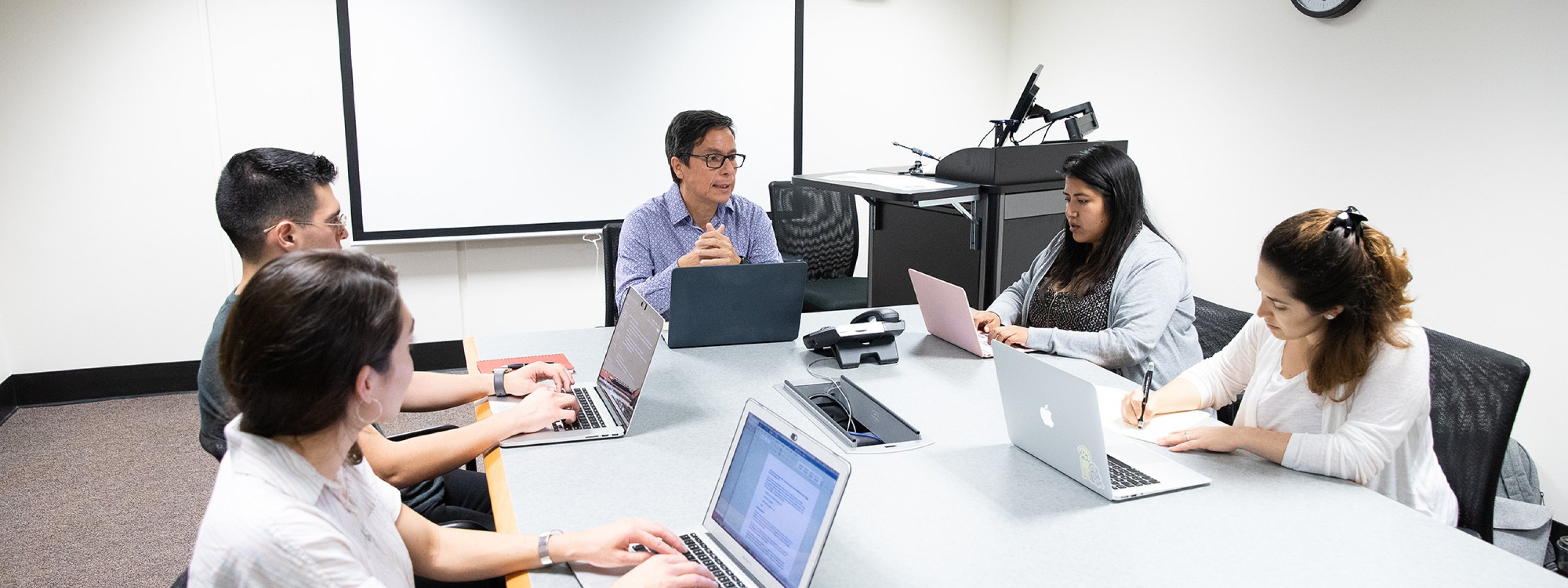 A group of students with a professor. 