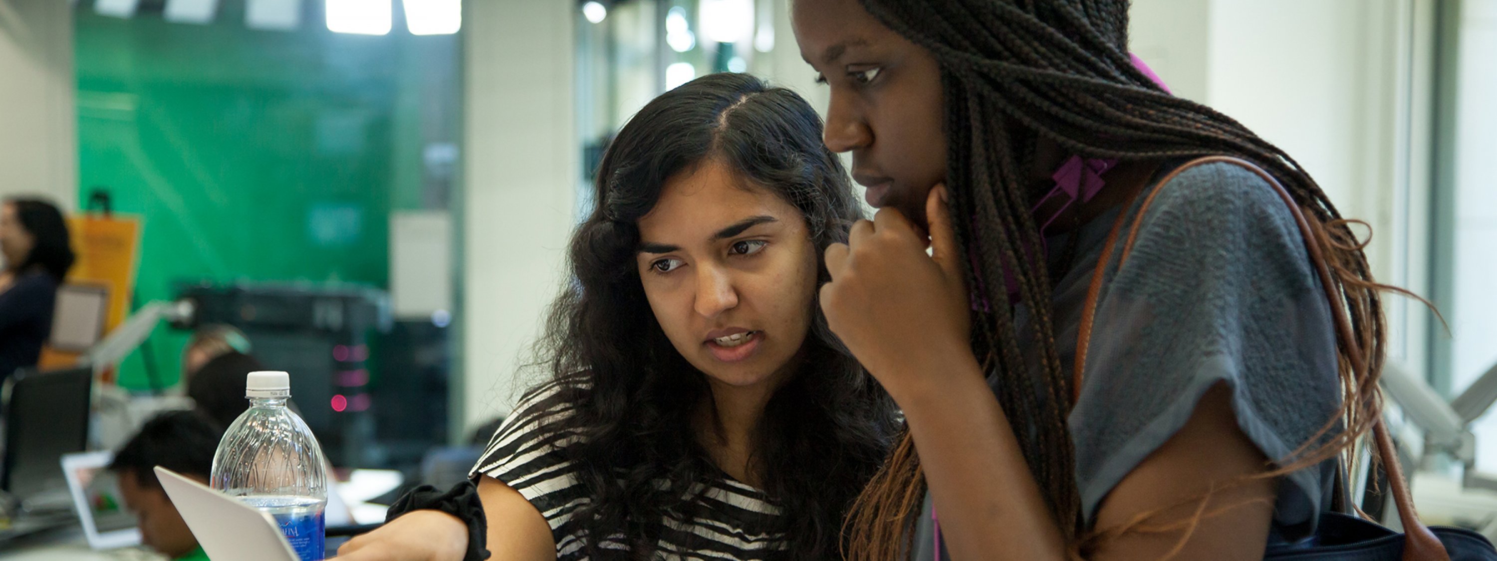 Two students working together in USC Annenberg