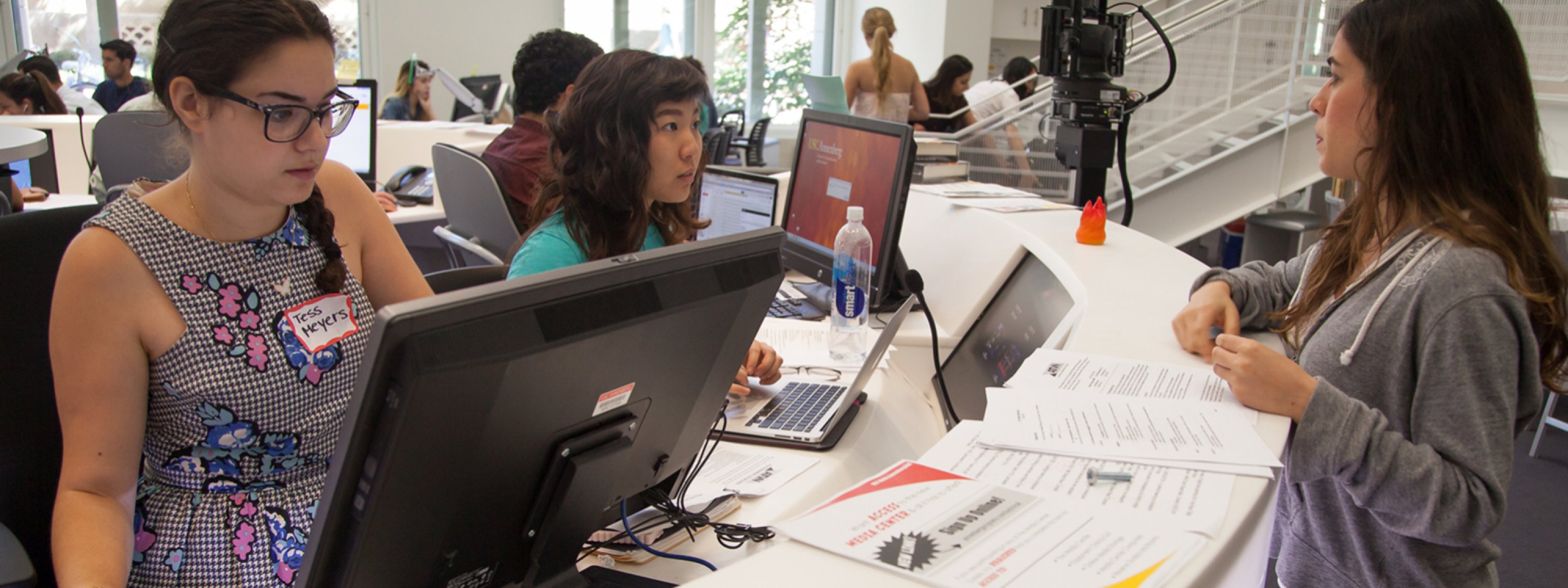Photo of three people working together in the USC Annenberg Media Center
