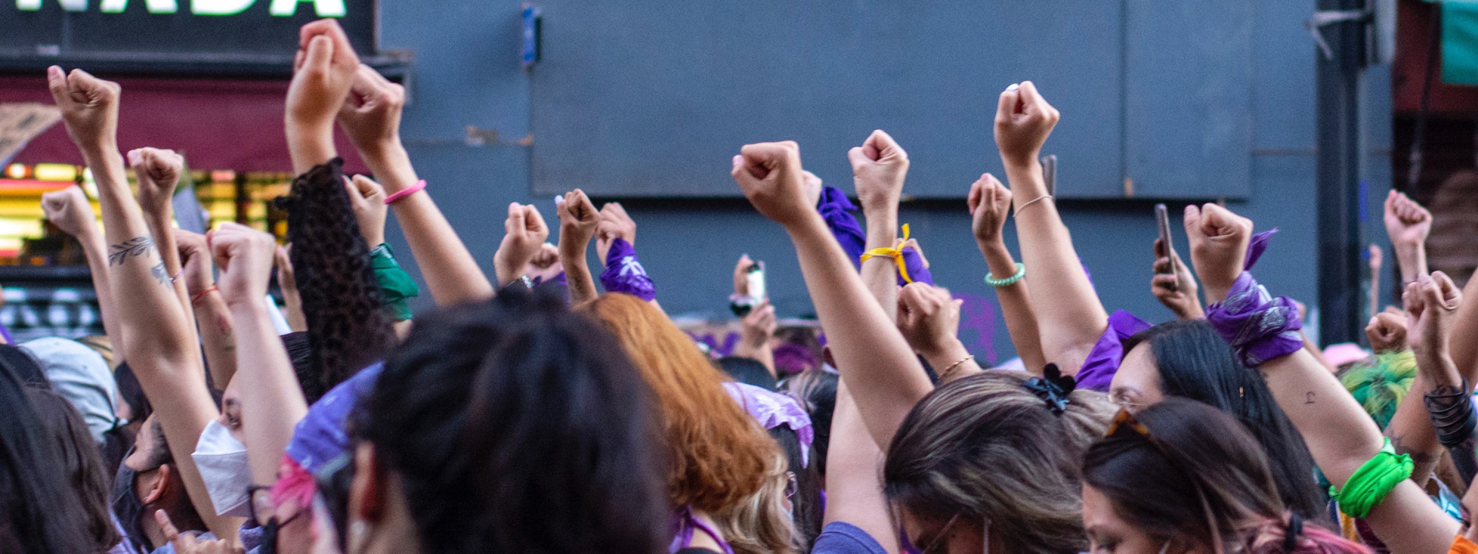 Group of people with fists raised. 