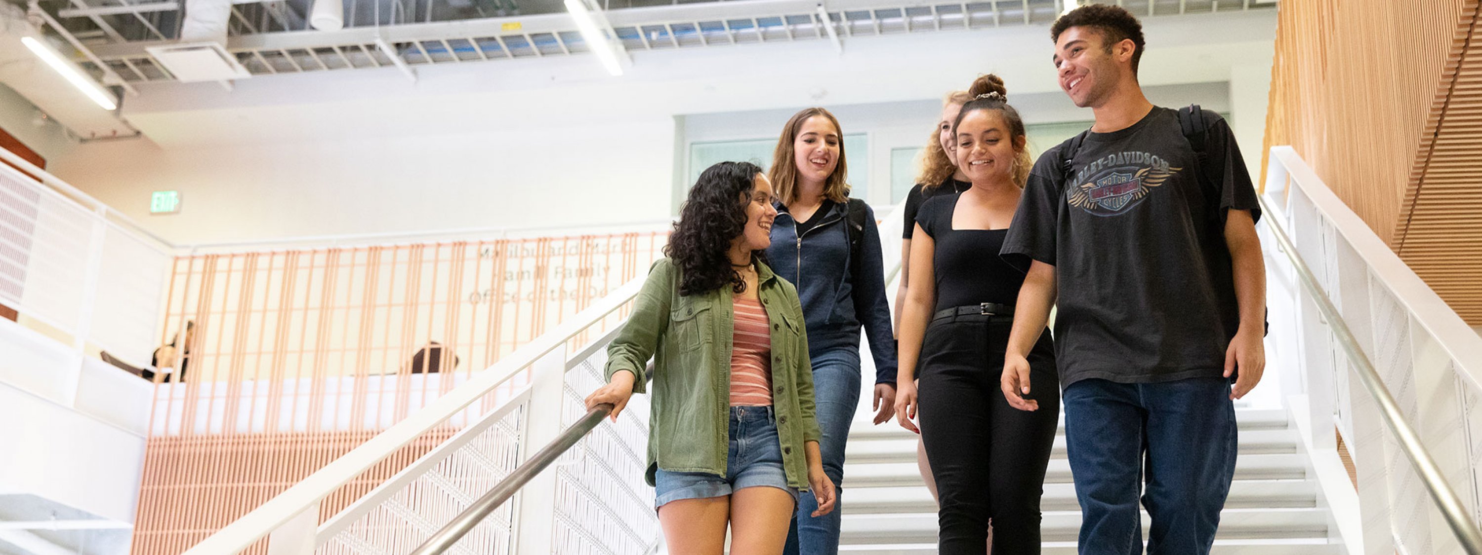 Photo of people walking down the stairs in Wallis Annenberg Hall