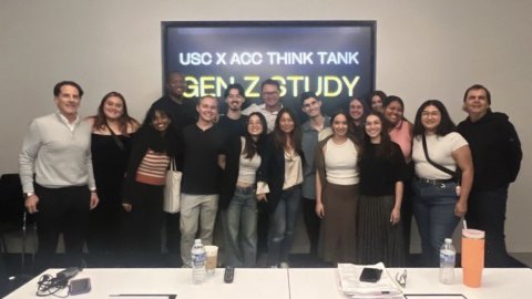 A group photo of students, a professor, and a member of the Board of Councilors.