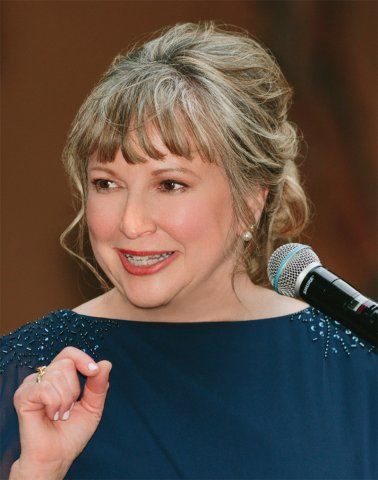 Diane Winston, Knight Center Chair in Media and Religion speaking at a microphone