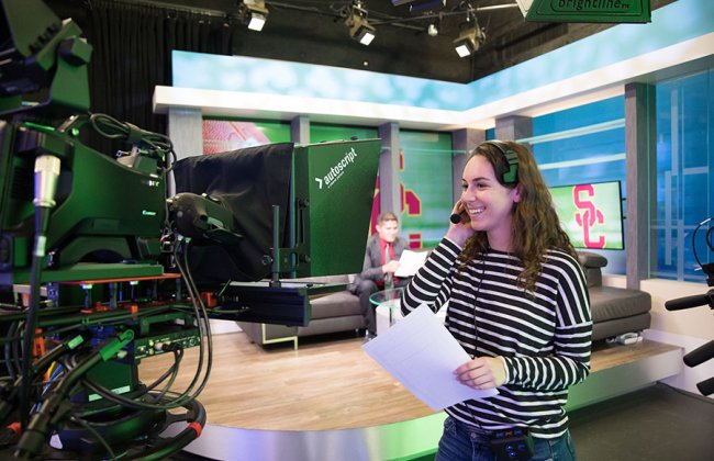 Photo of a USC Annenberg student in the media center studio