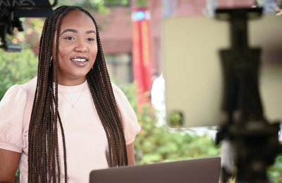 An African-American student looks at her computer for Charlotte Bass Lab.