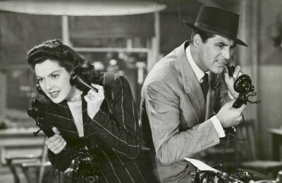 Scene from His Girl Friday where two people are on the phone back to back.