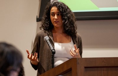 Photo of Sulafa Zidani, a doctoral student in communication, presenting at the summer doctoral institute.