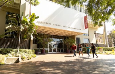 Students walking outside ASC on a sunny day.