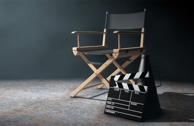 Photo of a chair next to a film clapperboard