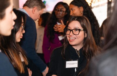 Public relations and advertising major Andrea Fernandez Cruz networks in a group of people.
