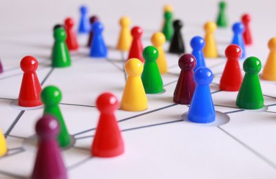 A visualization of a network featuring gameboard pieces on a lined surface.