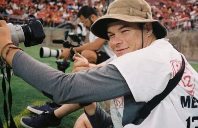 Yannick Peterhans taking a photo at a USC Football game.
