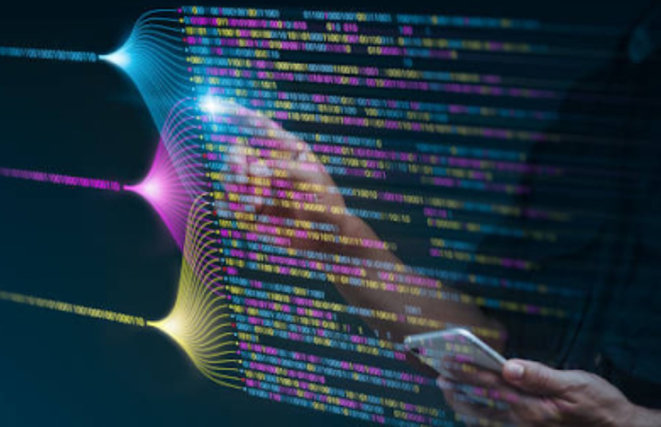 Someone interacting with code, projected into the air by light
